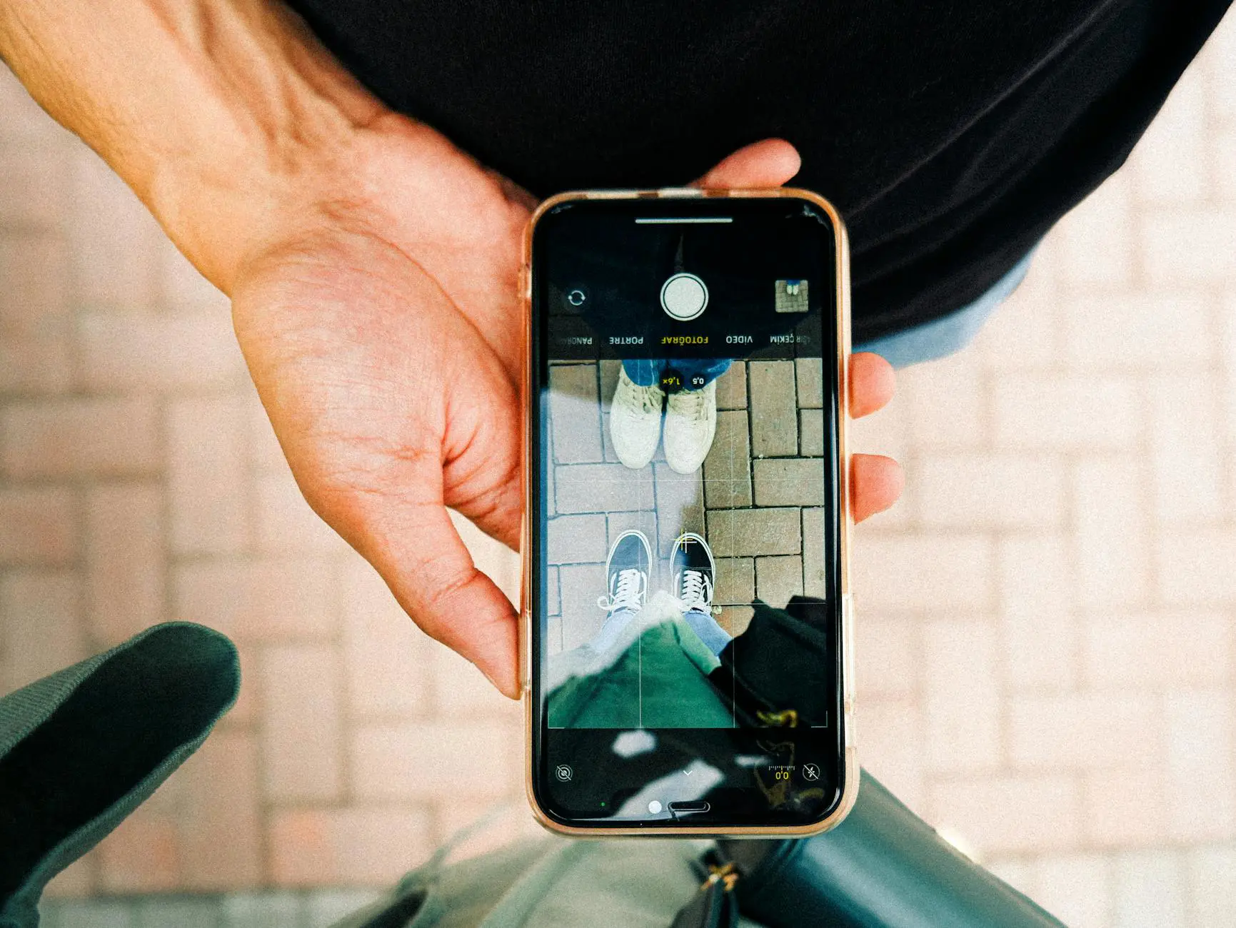 Person browsing social media on a smartphone in outdoor setting