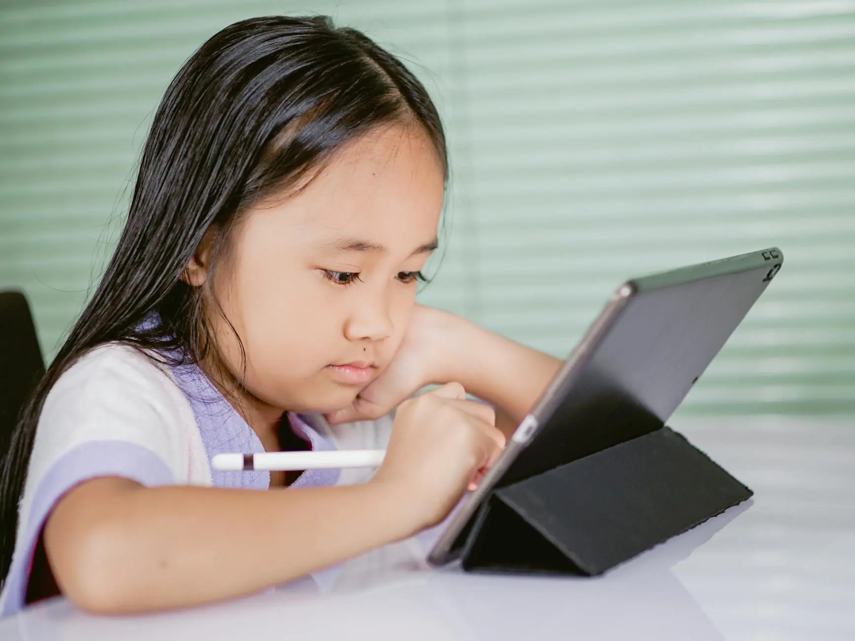 AI for kids - child learning with tablet and digital tools