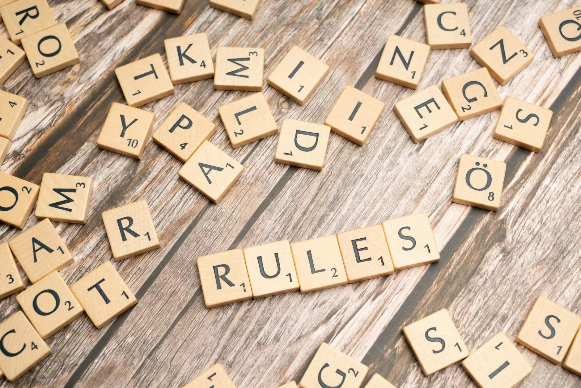 Wooden letter tiles spelling Rules representing 10 golden rules for better AI results