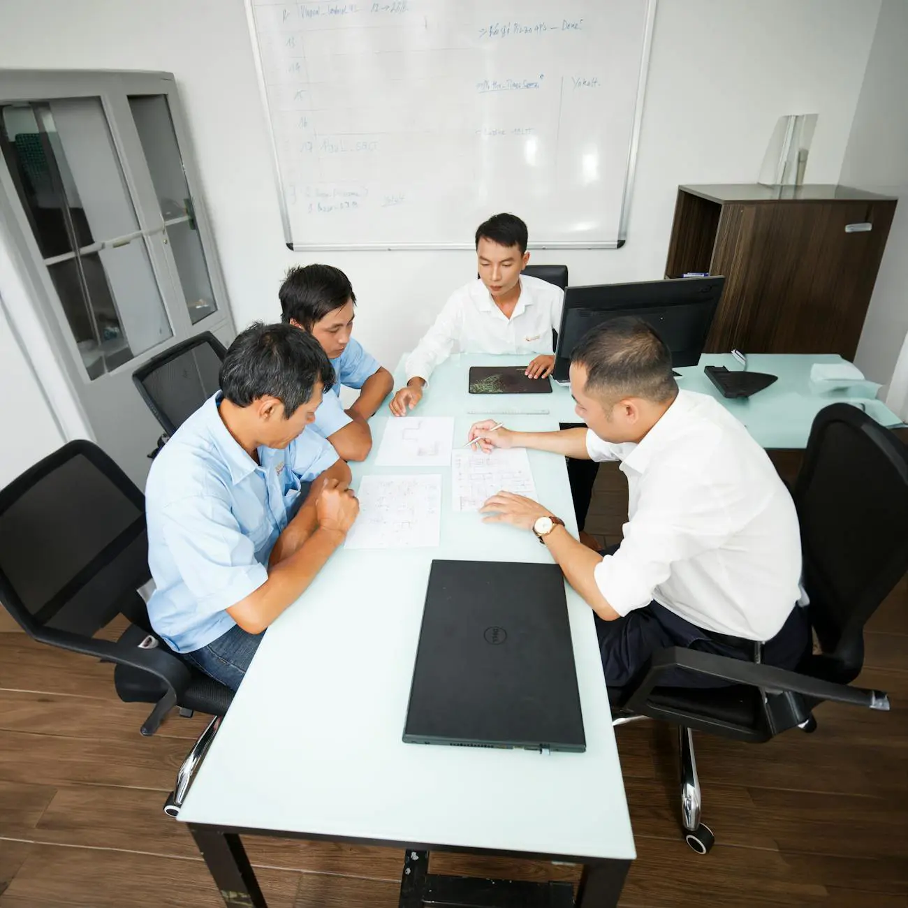 Business team discussing CRM software strategies at a meeting