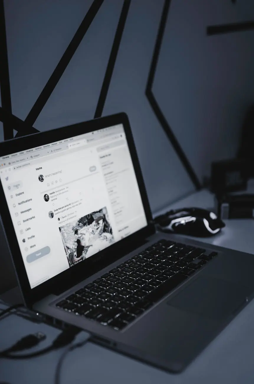 Laptop and wireless mouse on a clean workspace - email management and productivity