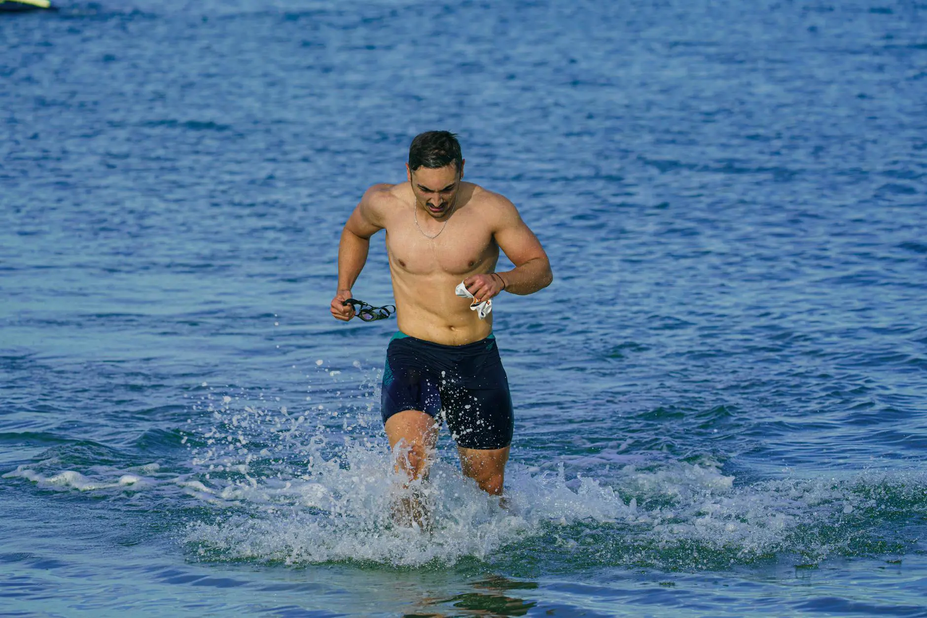 Athlete using wearable sports technology during outdoor training