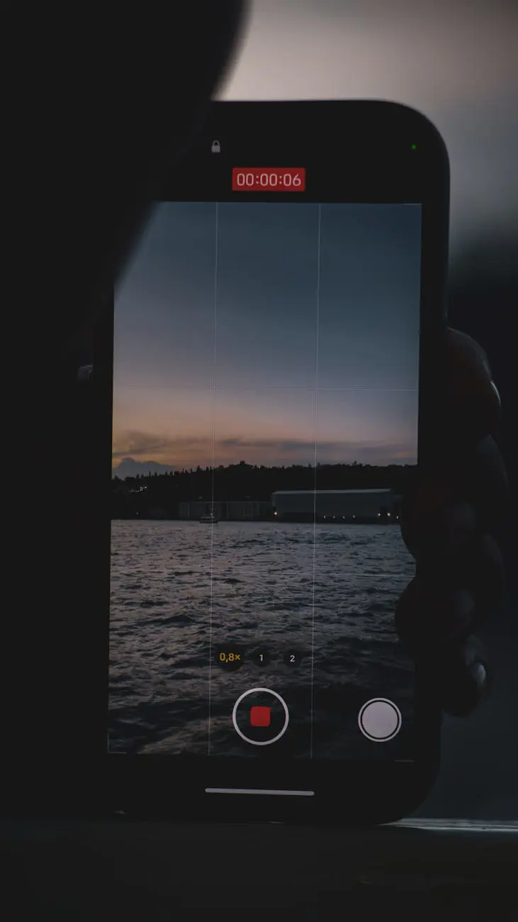 Person recording video content on smartphone for social media marketing